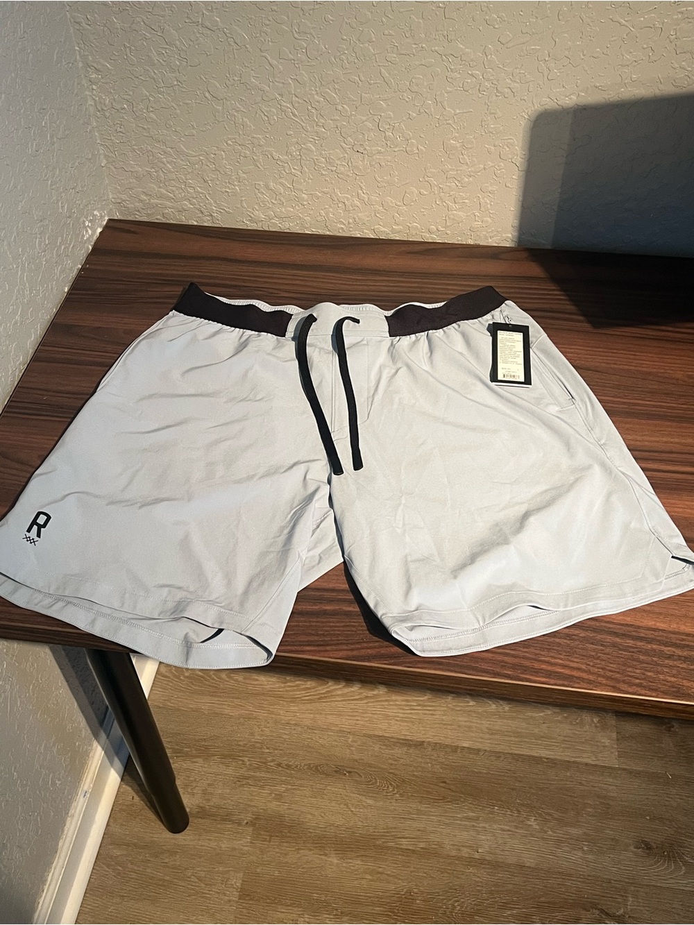 RHONE 8 inch base training shorts in Arctic Blue